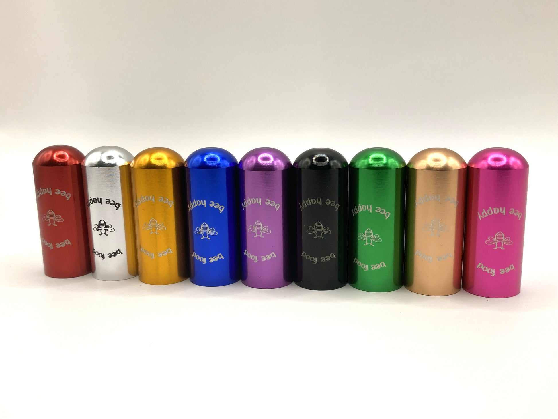 Image showing the eight different keyring colours available in the bee revival kit - red, silver, gold, blue, purple, black, green, rose gold and pink